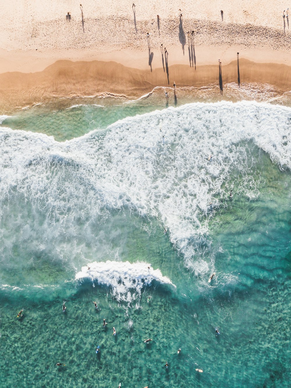 wavy seashore during daytime