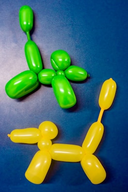 Creative balloon sculptures shaped like animals at a festive event.