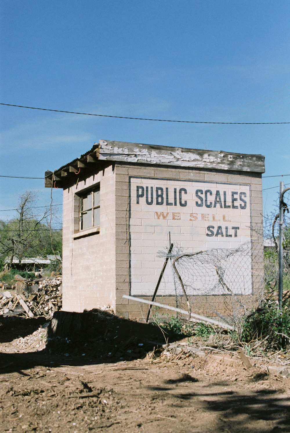Public Scales we sell salt sign on concrete shanty