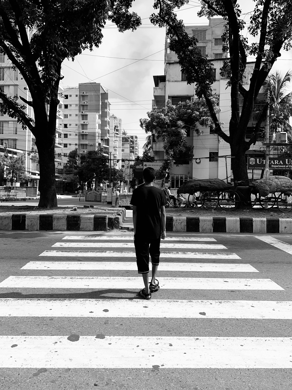 man crossing pedestrian lane