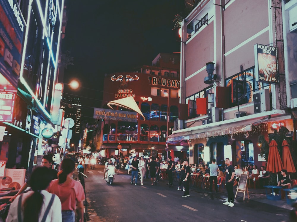 people gathering near brown concrete building