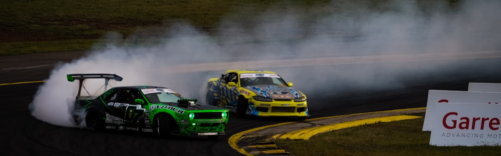 two yellow and green cars on road