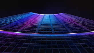 multicolored curtain wall building during nighttime
