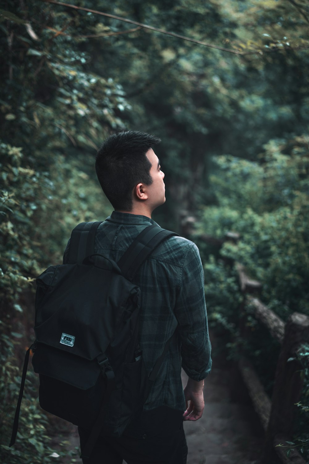 man wearing black backpack during daytime