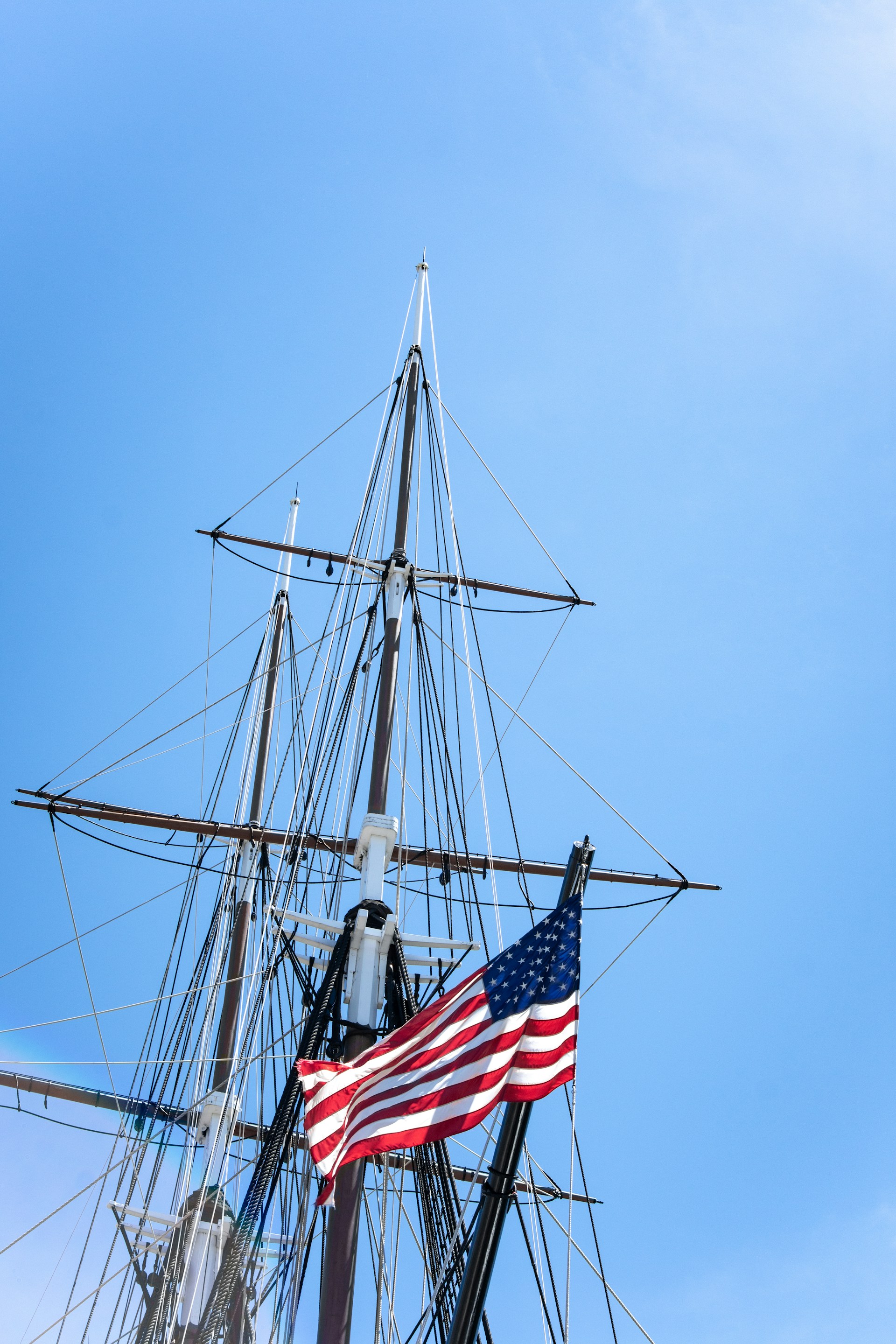 flag of America hanging on metal post