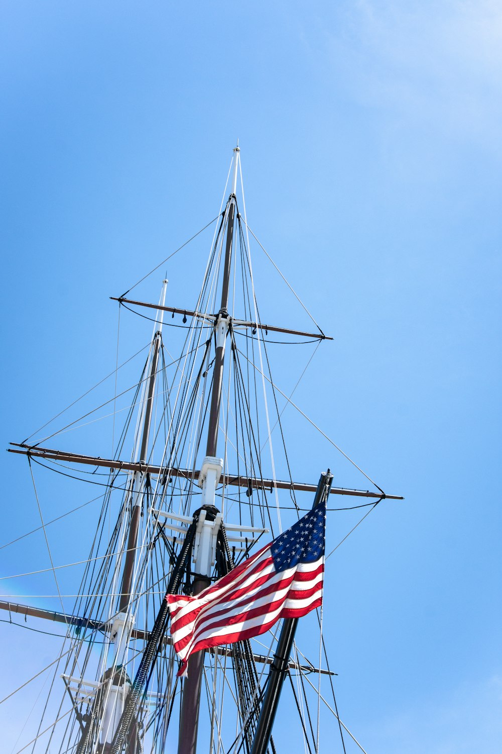 flag of America hanging on metal post