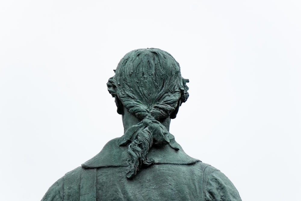 a statue of a woman with a braid in her hair