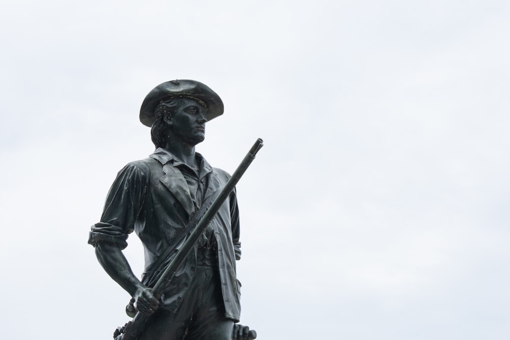 man wearing cap statue