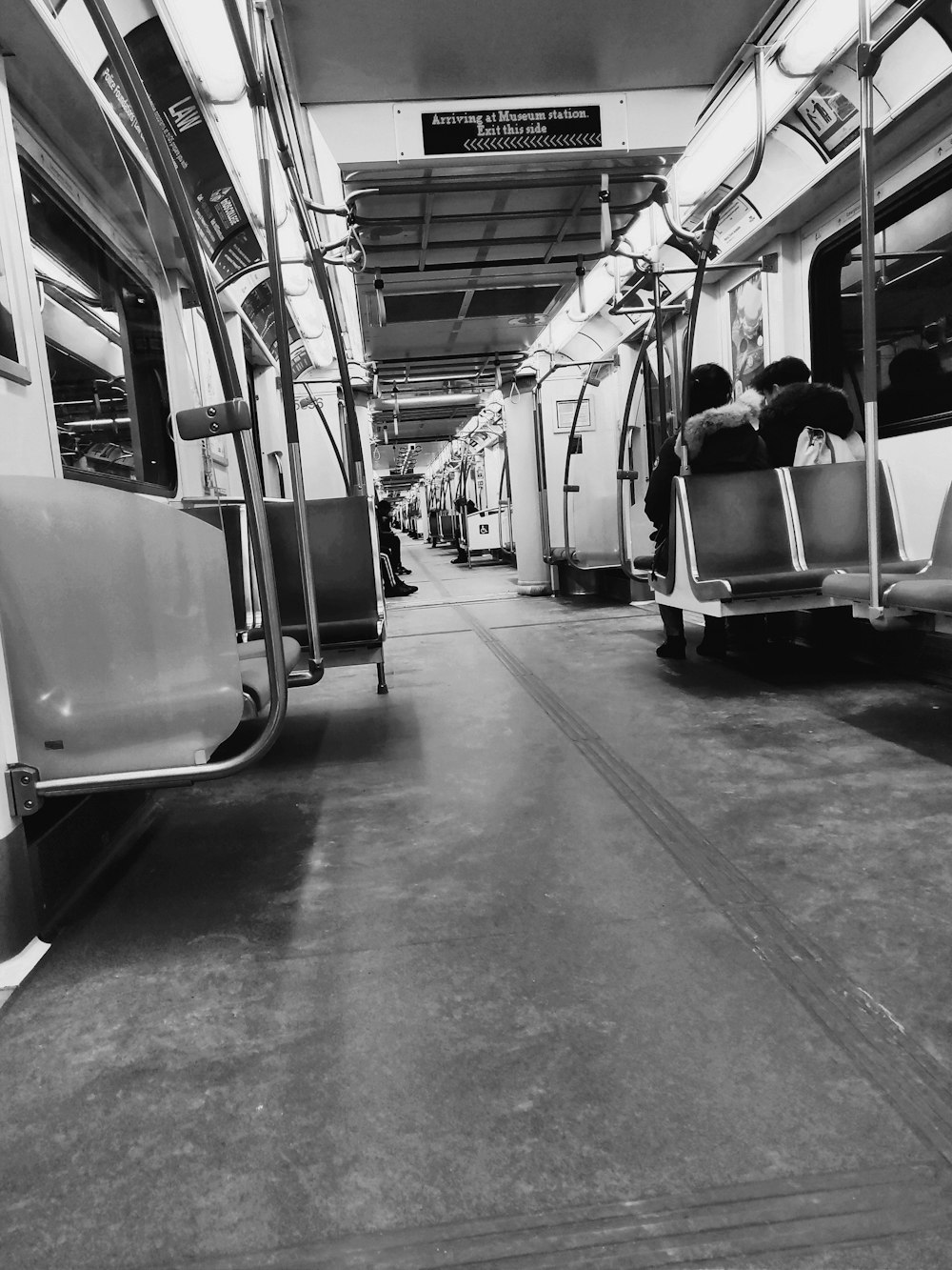 grayscale photography of train interior