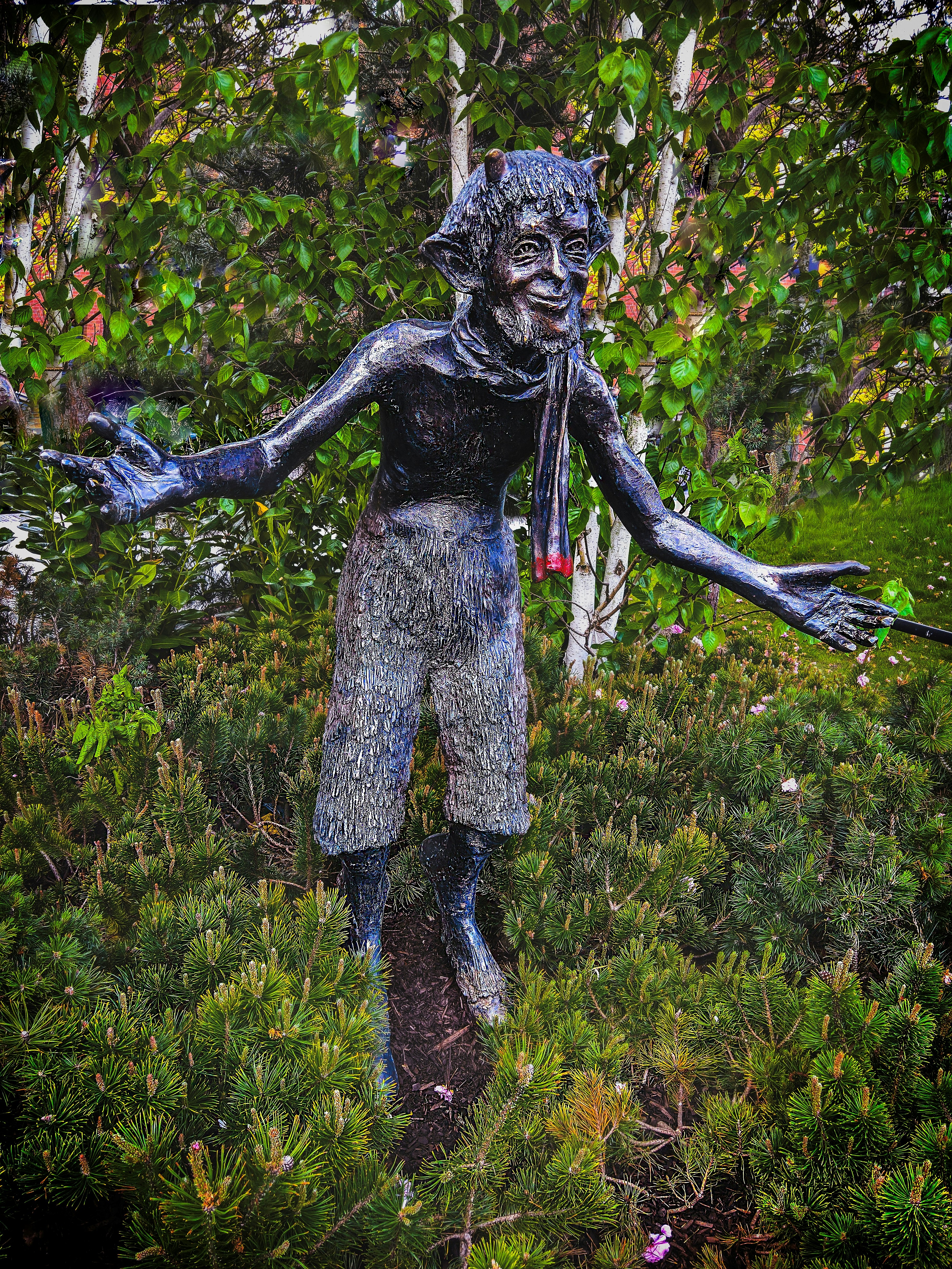 animal man creature statue near trees