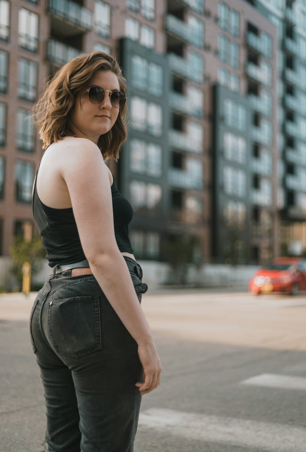 woman standing and glancing her right side