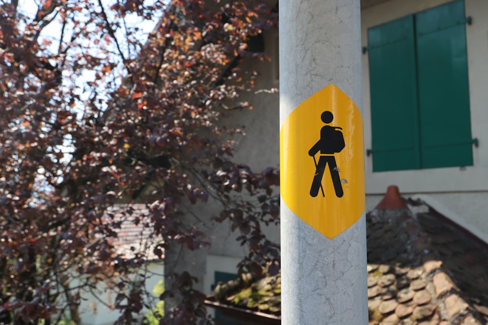 yellow signage on post