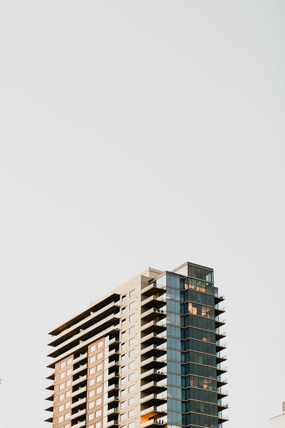 low-angle photography of gray and brown concrete high-rise building during daytime