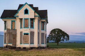 white and black 3-storey house