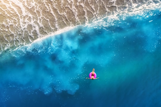 person floating using pink tube in Ölüdeniz Mahallesi Turkey