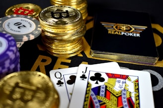 playing cards and Bitcoins near Poker set