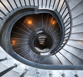 gray concrete spiral stairs with no people