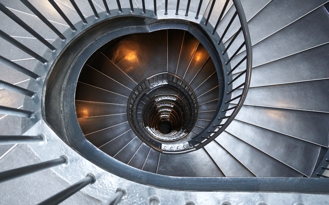 gray concrete spiral stairs with no people
