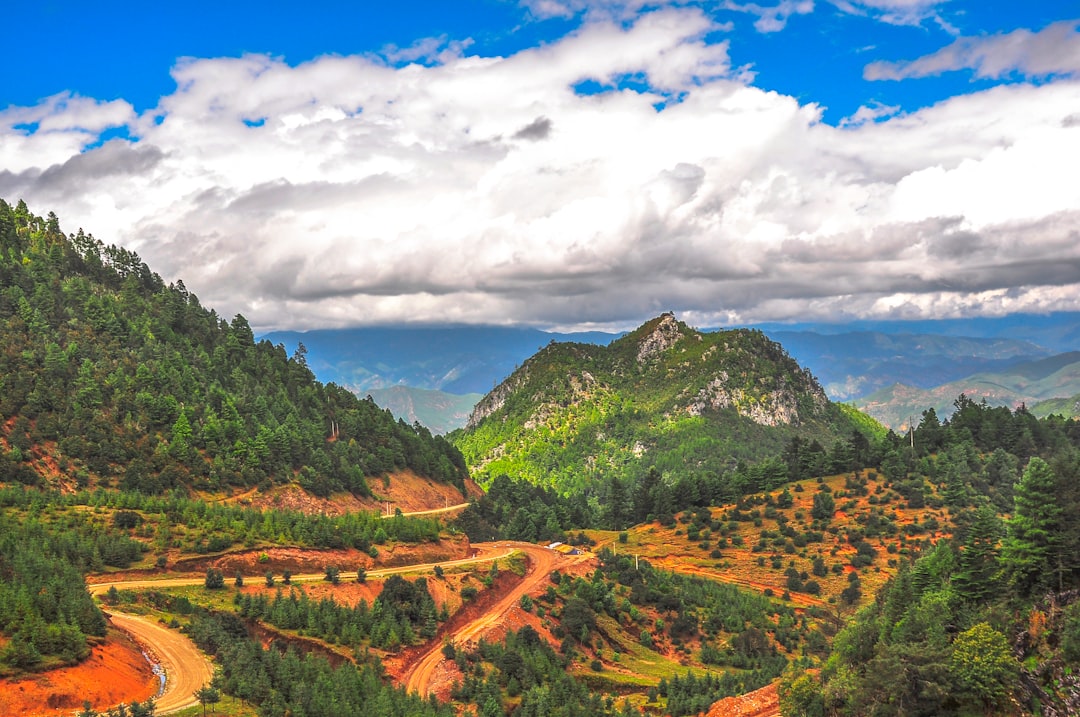 aerial photography of vast land under cloudy sky during daytime