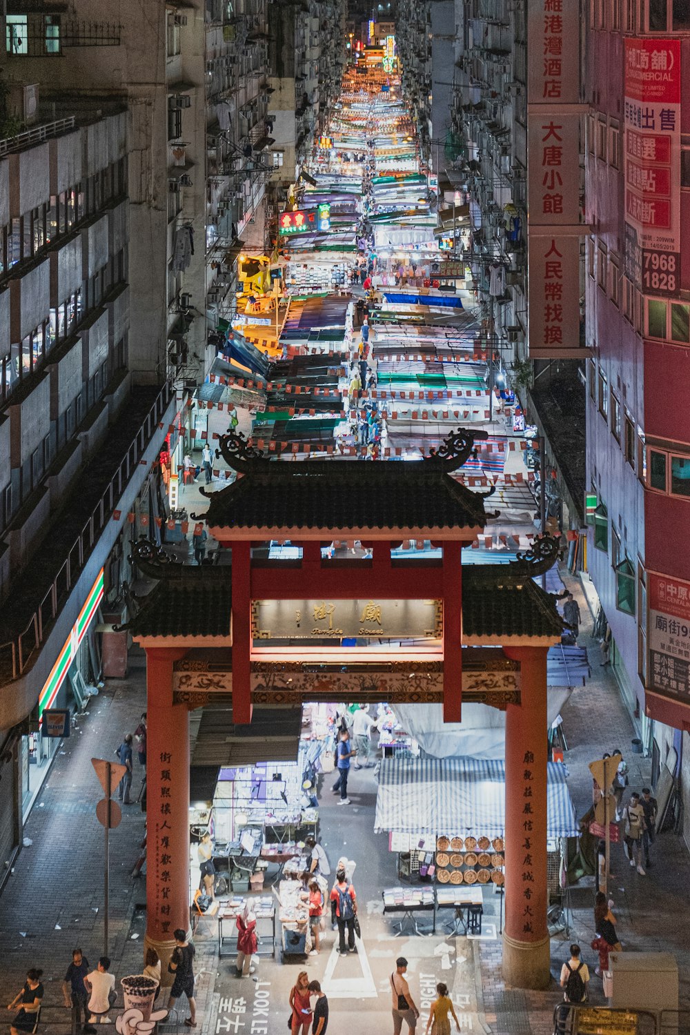 a city street filled with lots of tall buildings