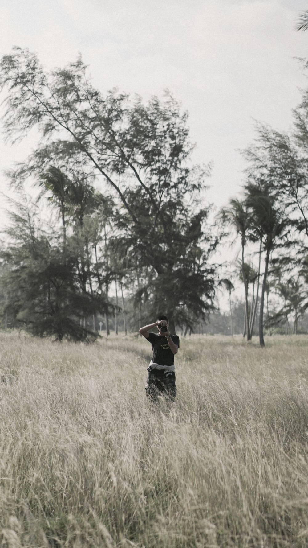 person standing on grass field