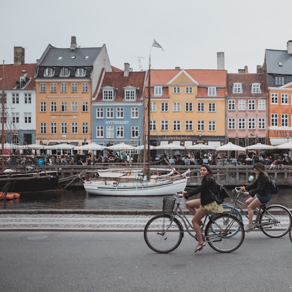 three people riding bicycles