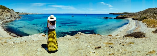 woman standing in front of body of water in San Bartolomé Spain