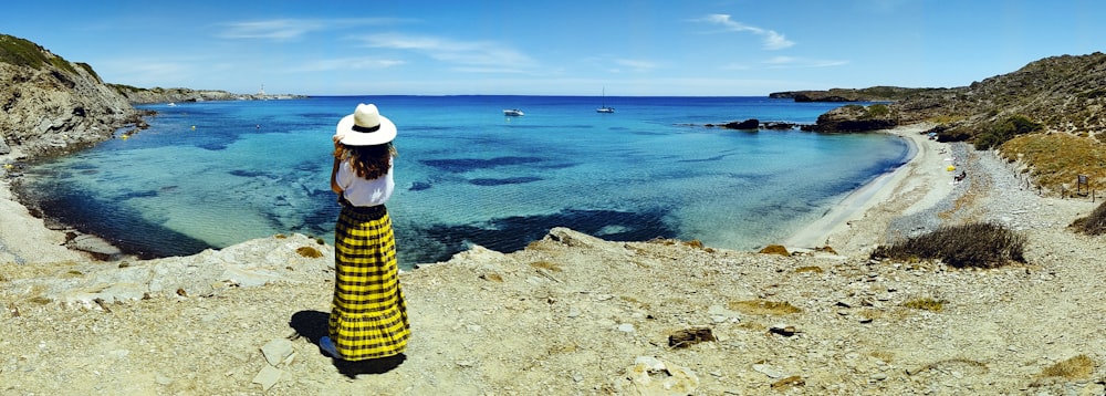 woman standing in front of body of water