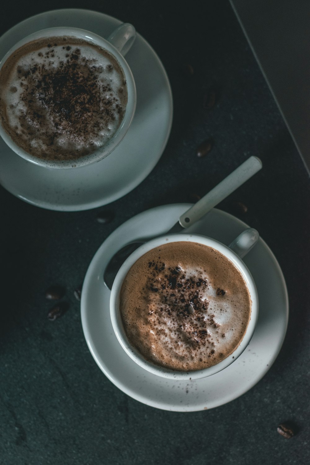 two white ceramic mugs