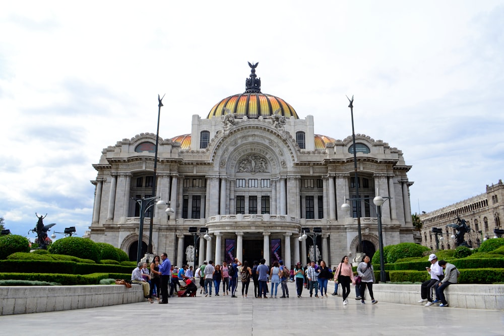 people walking outside dome building