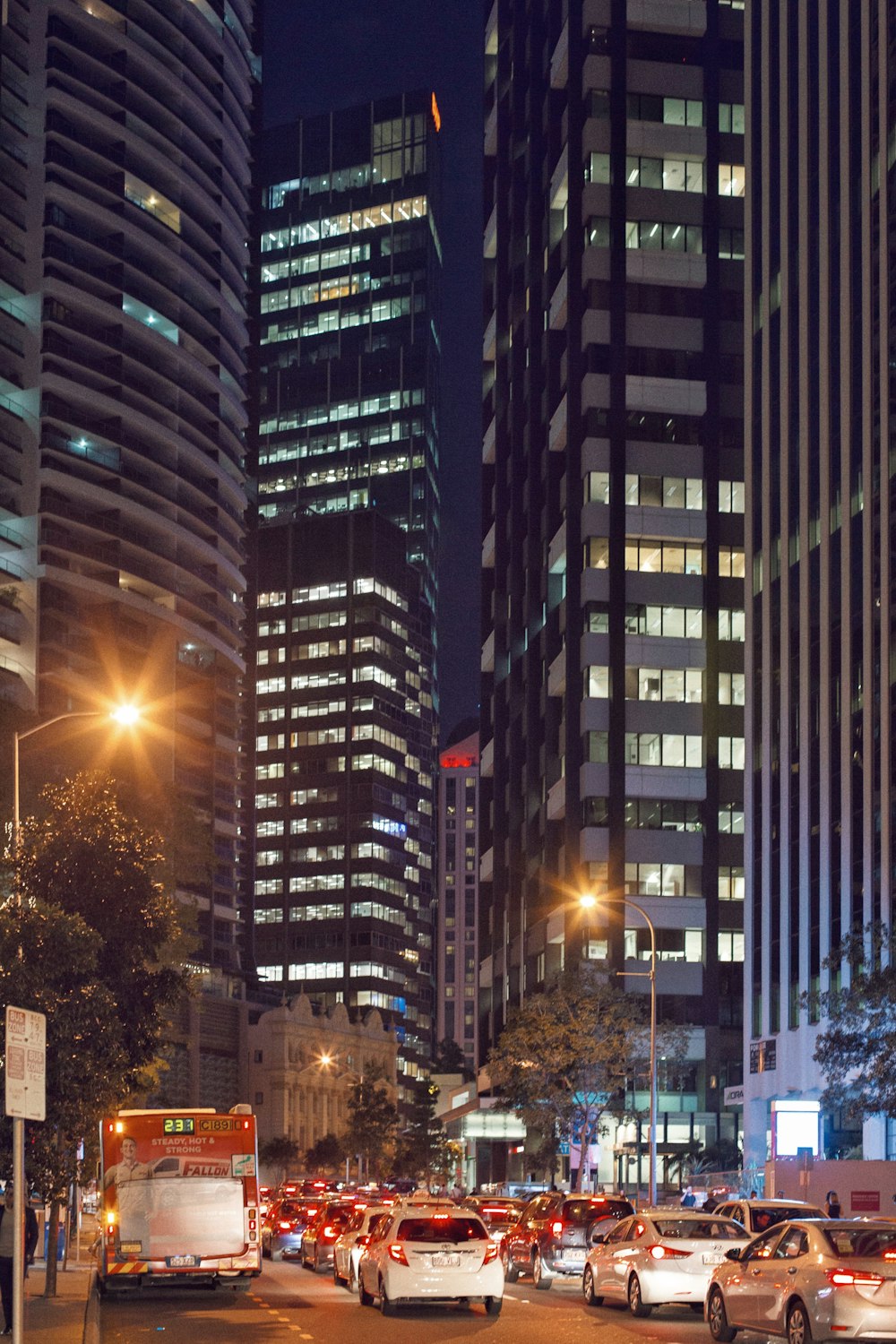 vehicles on road near buildings