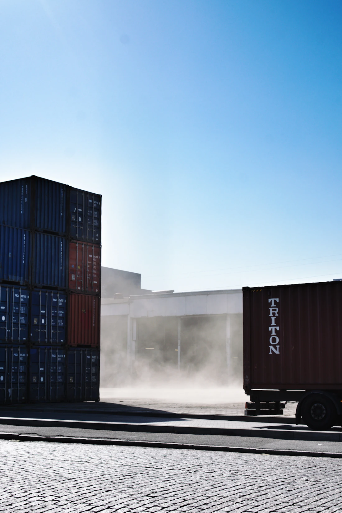 Shipping containers stacked at a freight terminal