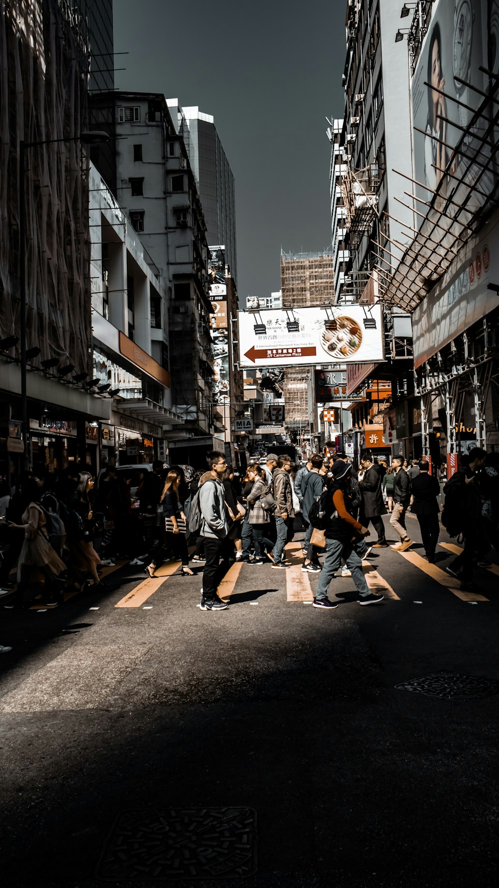 people passing pedestrian lane