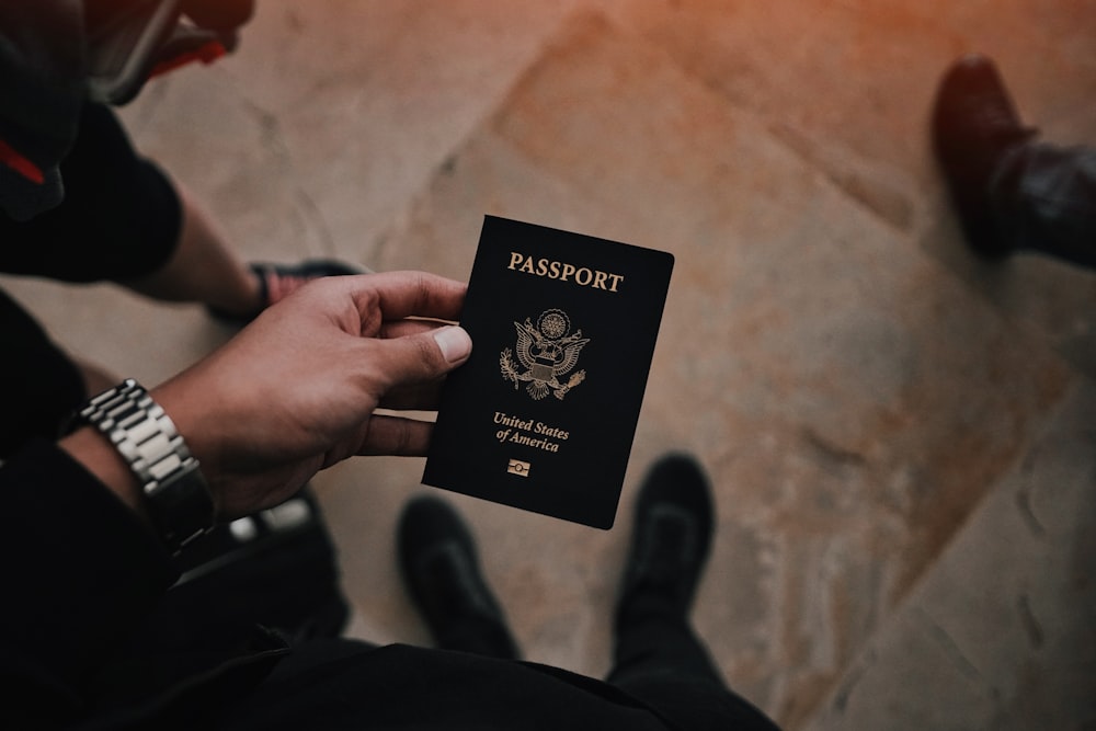 person holding passport