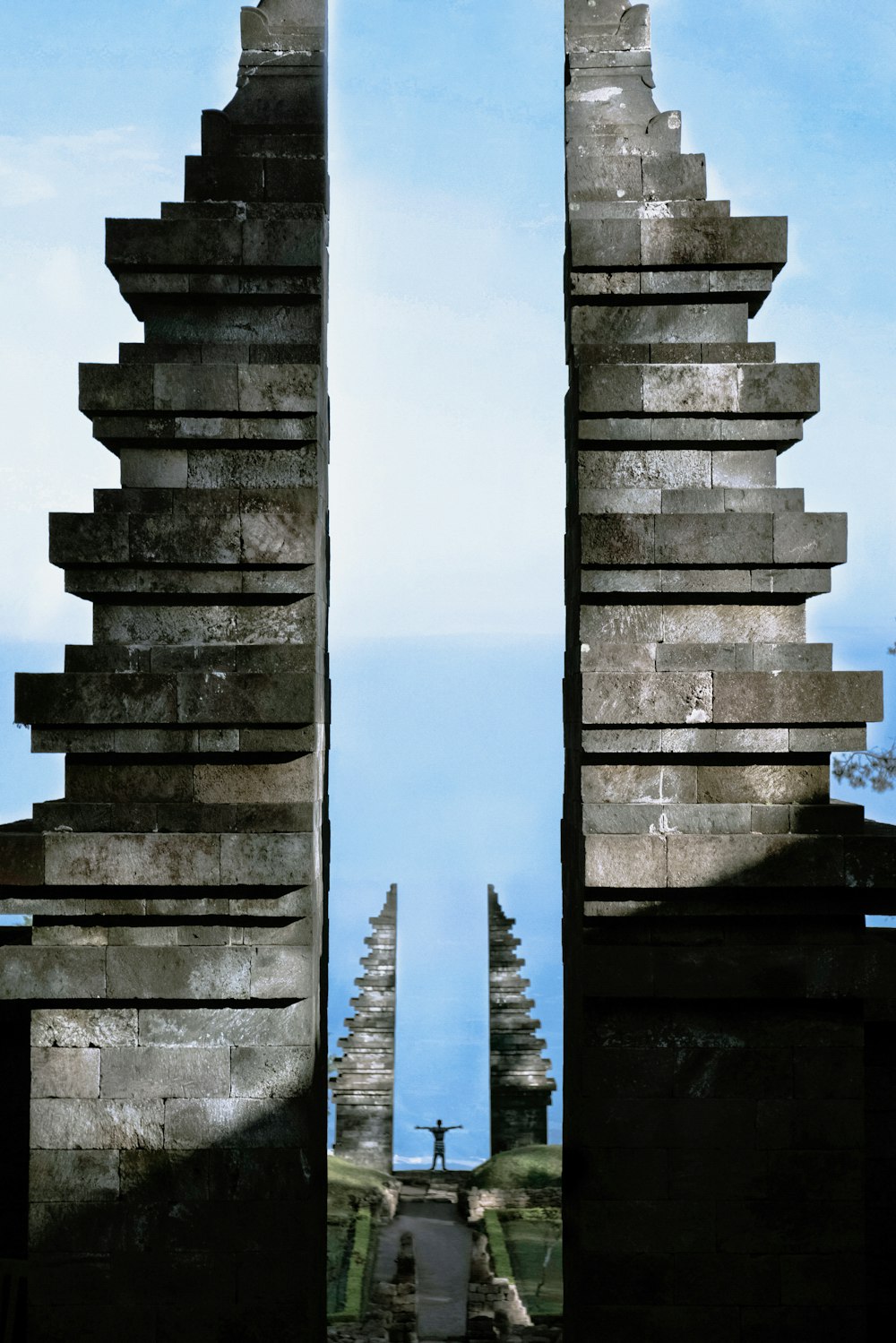 gray tower building under blue and white skies