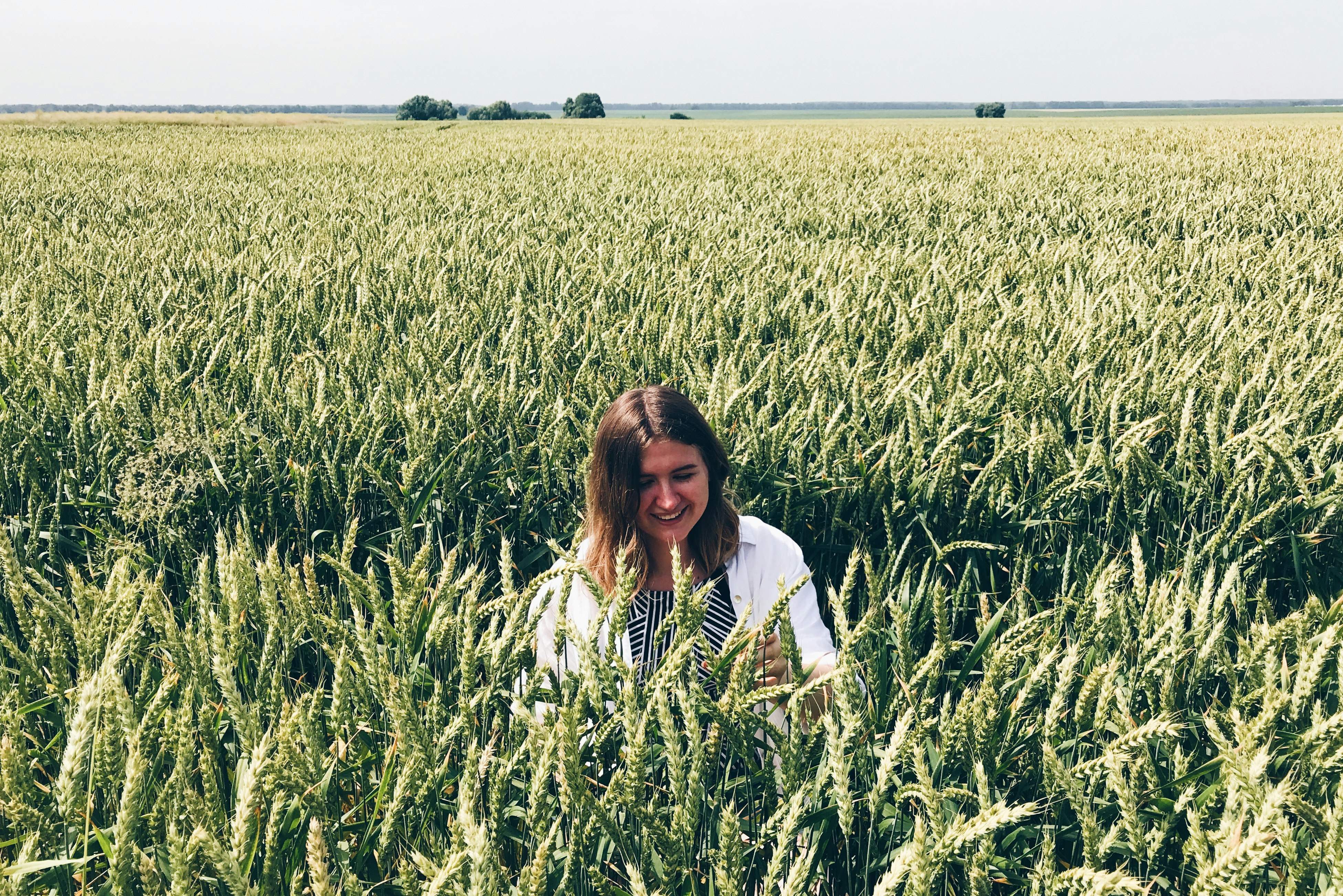 woman on green grass field during daytime