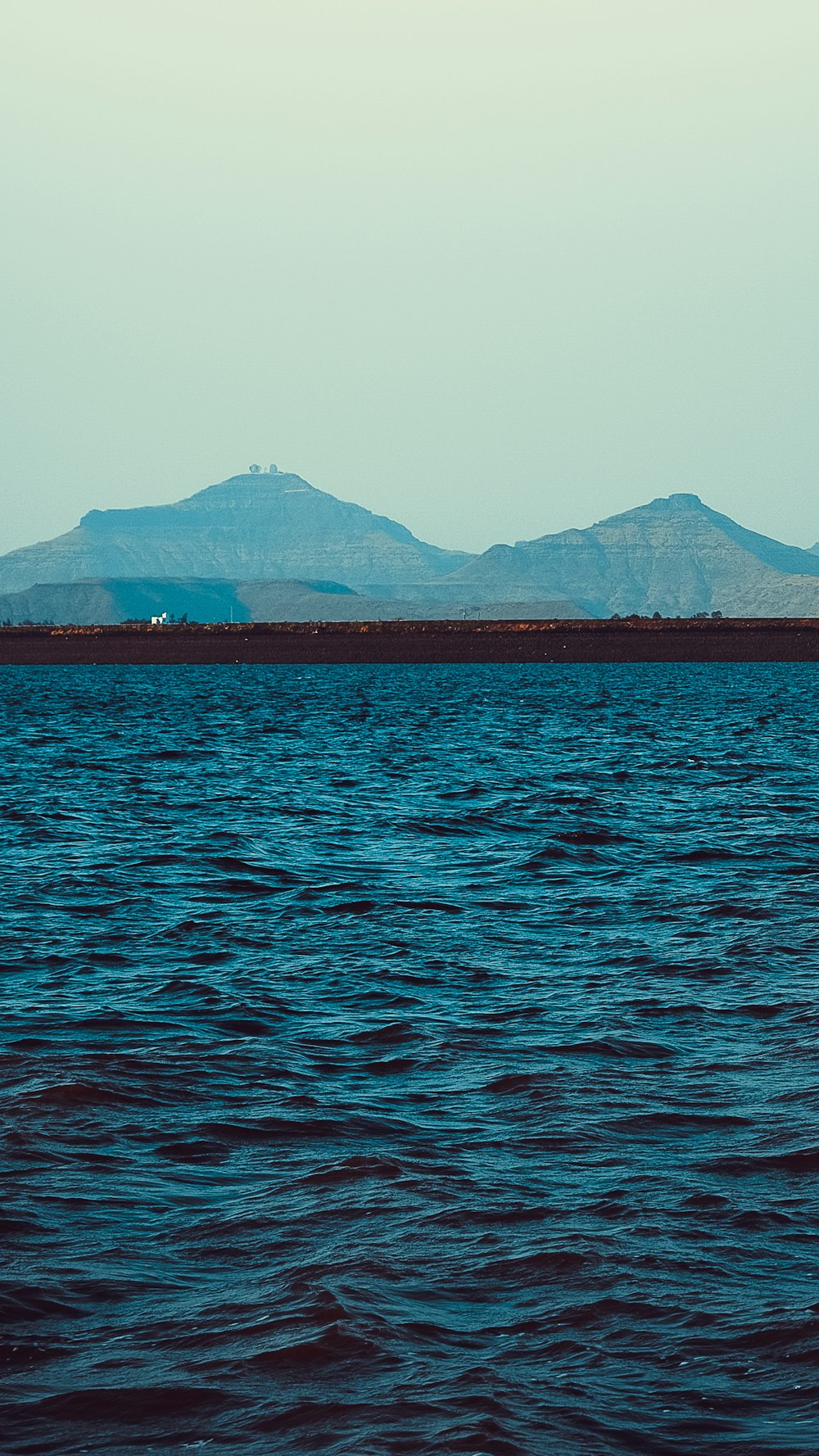 blue calm sea viewing mountain