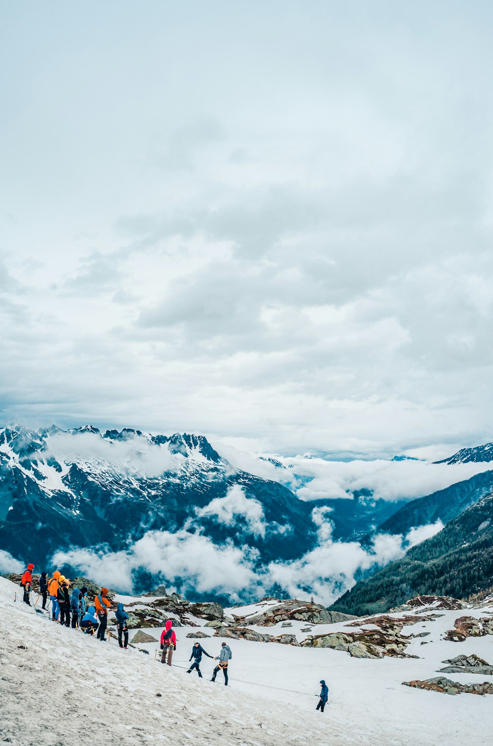 people standing on snow field