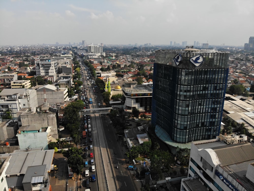 aerial photography of vehicle passing between buildings