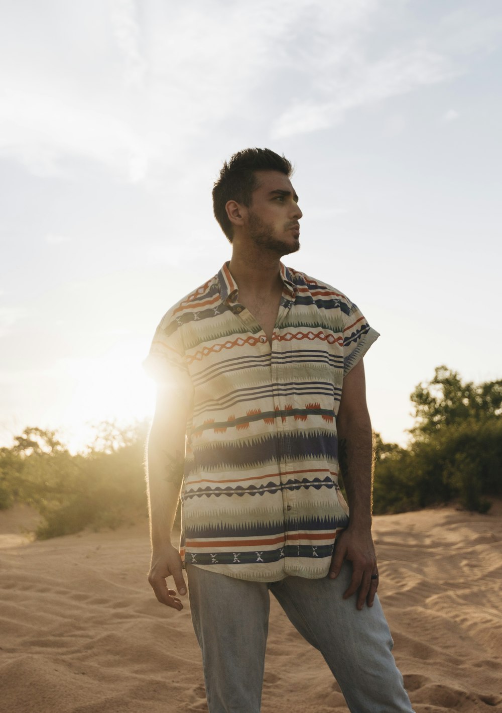 man wearing multicolored striped shirt