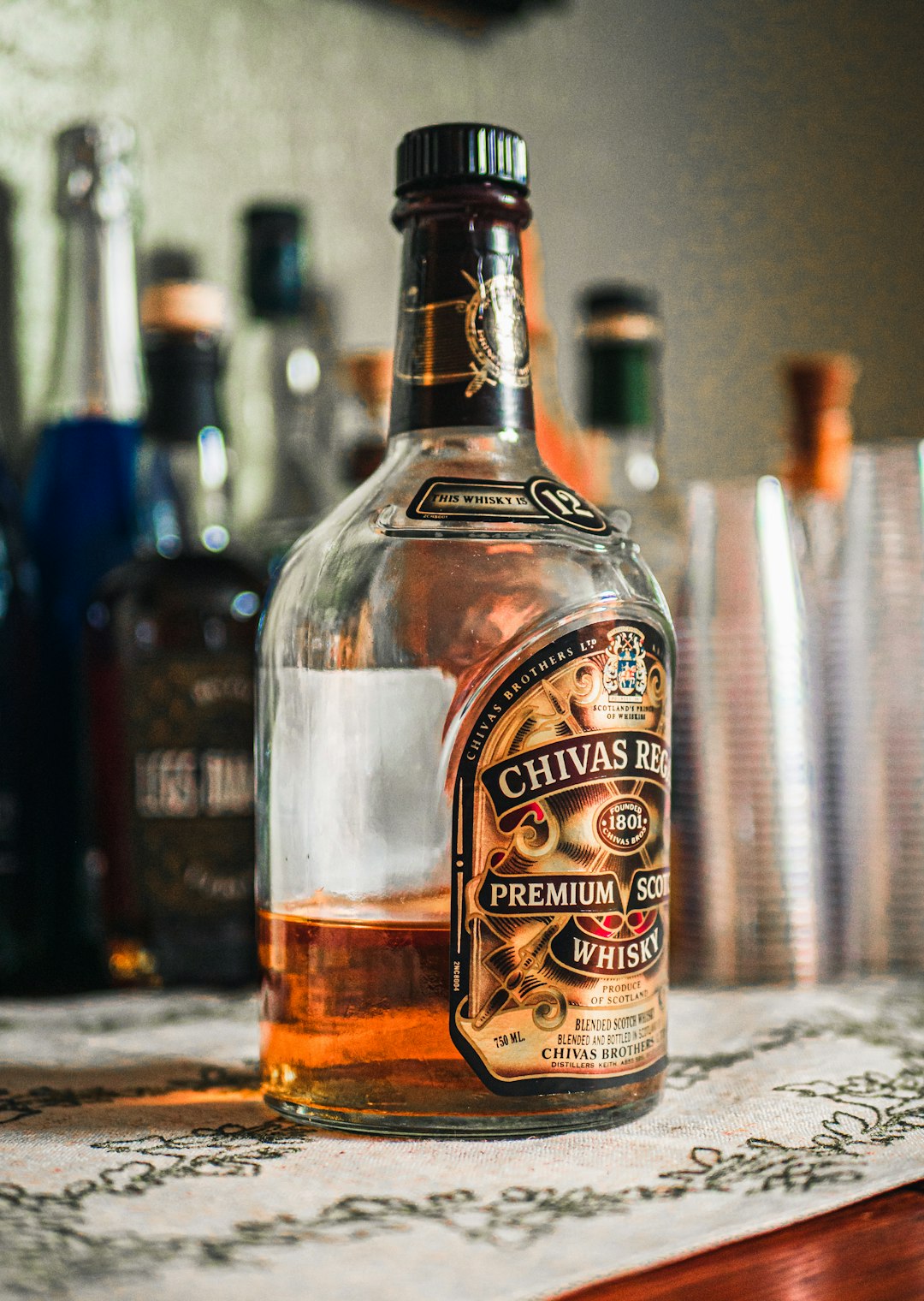 brown clear labeled bottle close-up photography