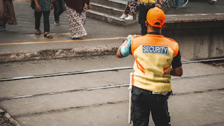 man standing on road