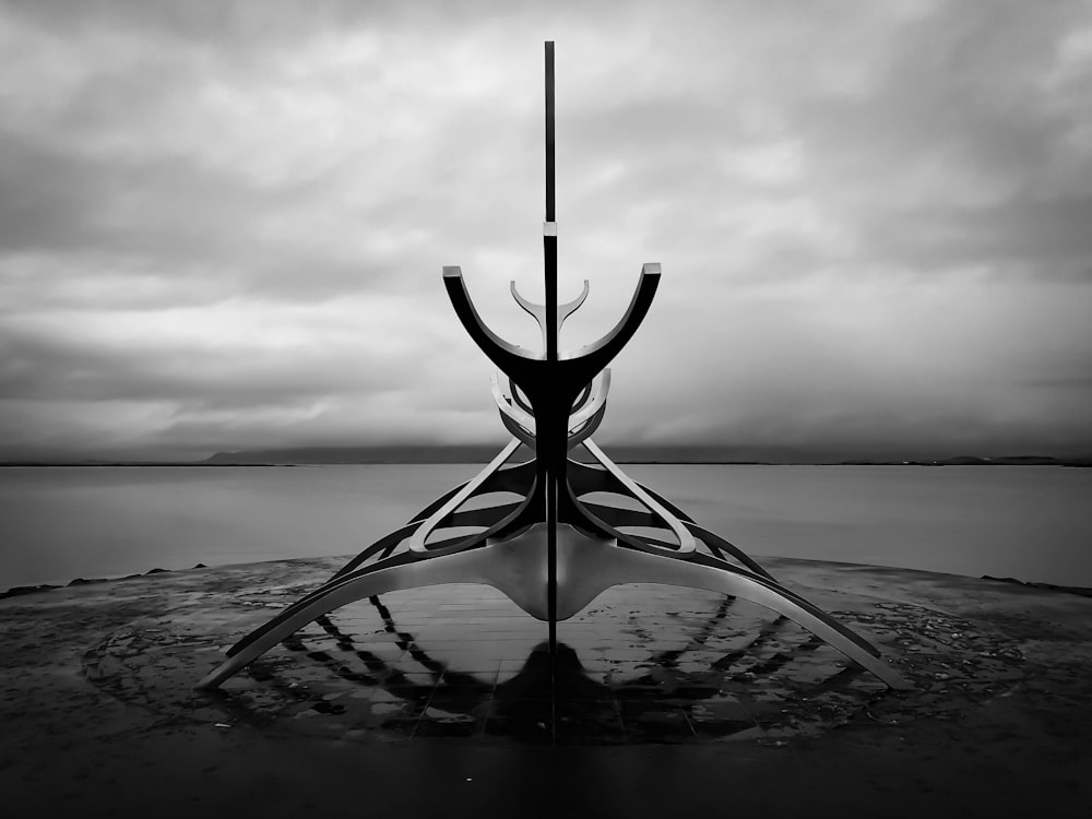 a black and white photo of a boat in the water