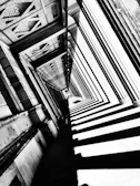 Black and white image emphasizing the contrast and shadows of architectural columns