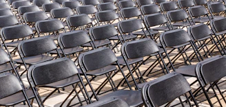 black folding armless chair lot