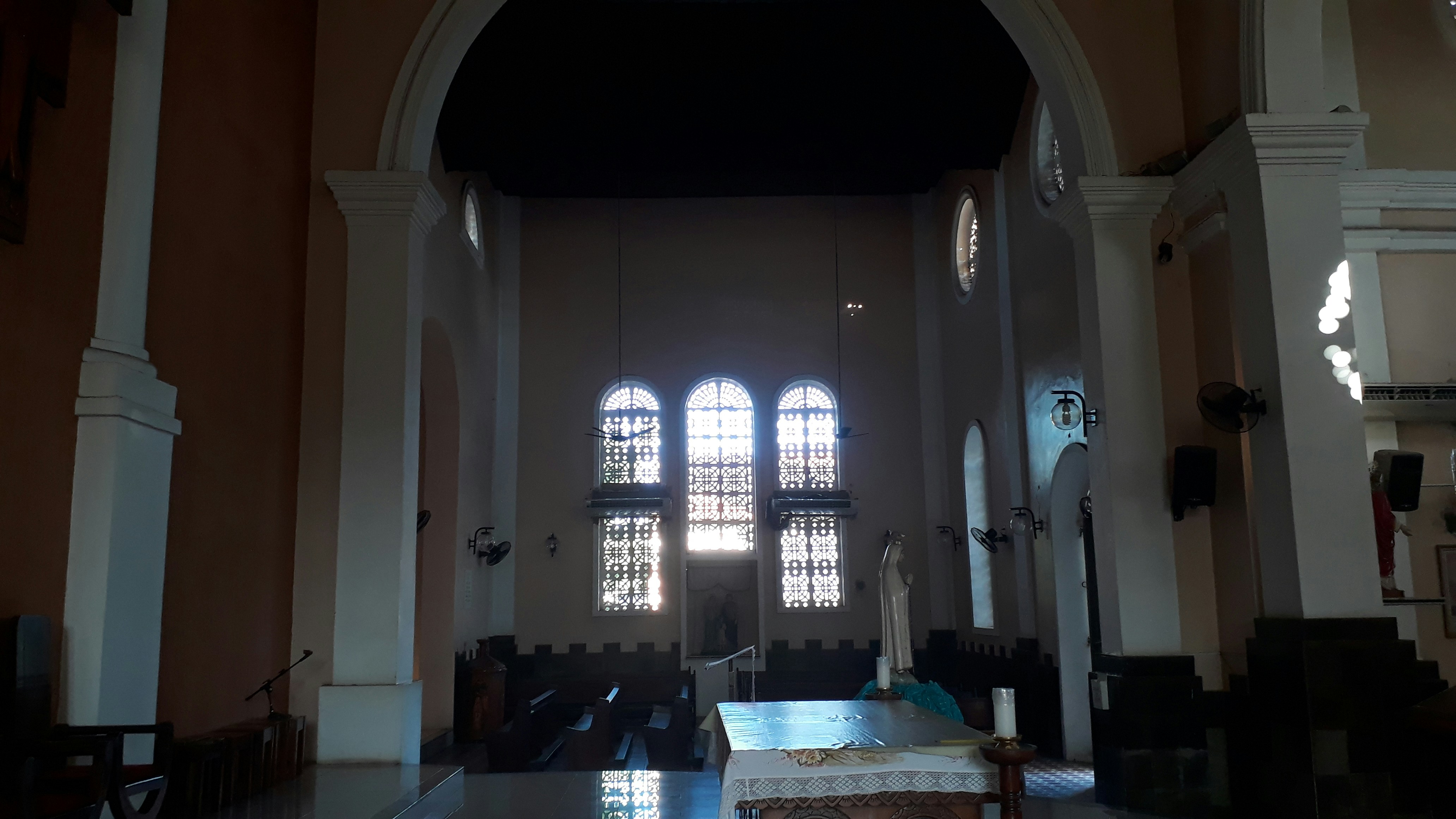 Church interior with light streaming through windows