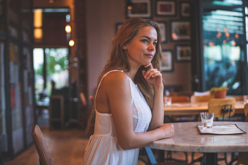 women wearing a white cami dress