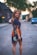 woman standing in the middle of road