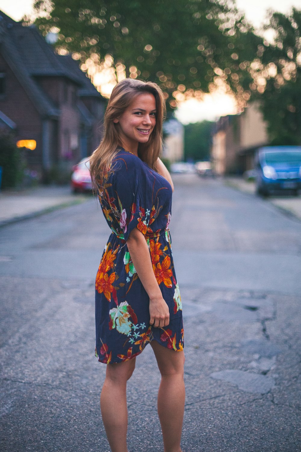 woman standing in the middle of road