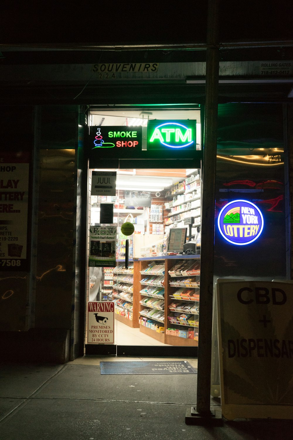 glass panel door with green ATM signage